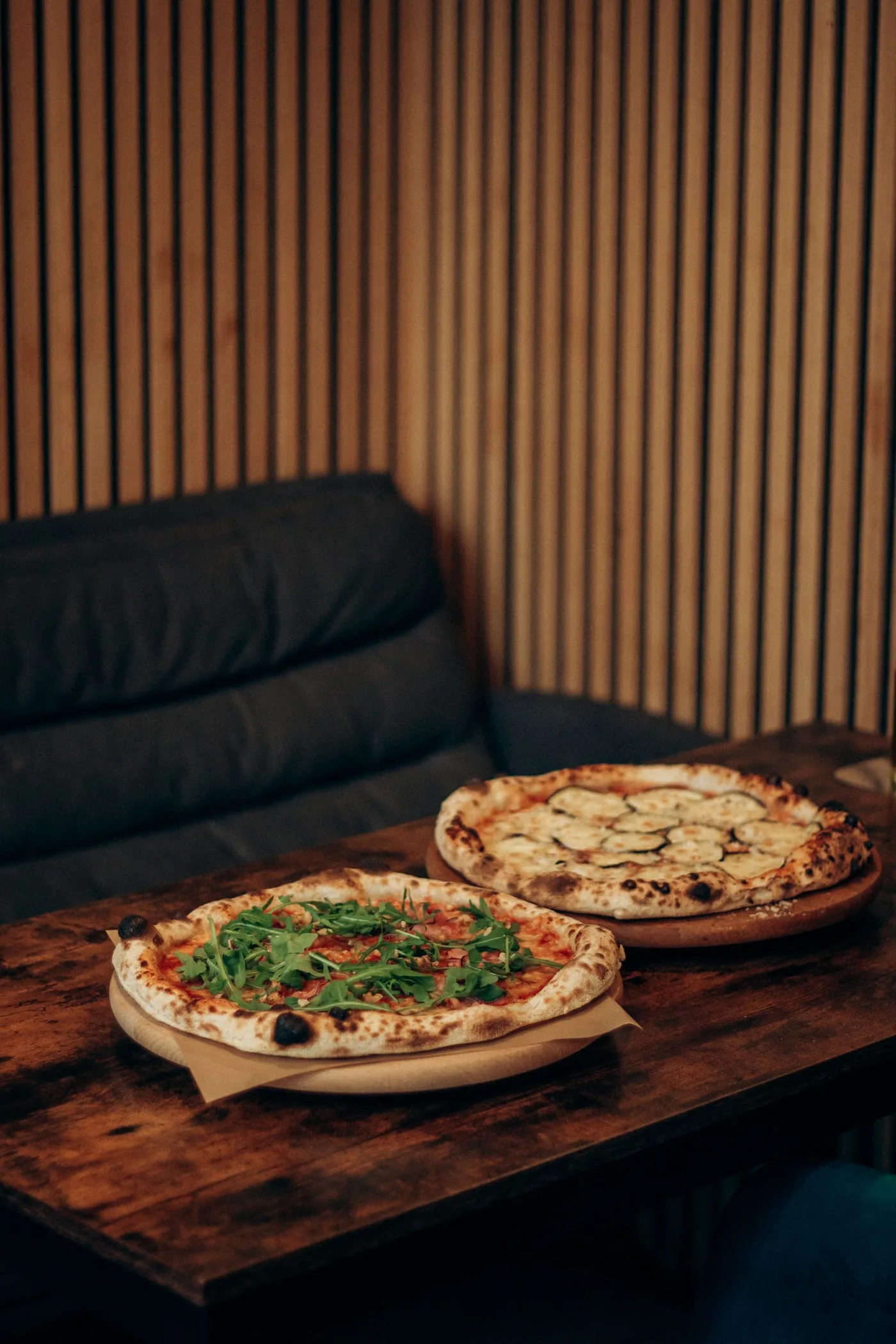 Freshly boxed wood-fired pizzas ready for pickup